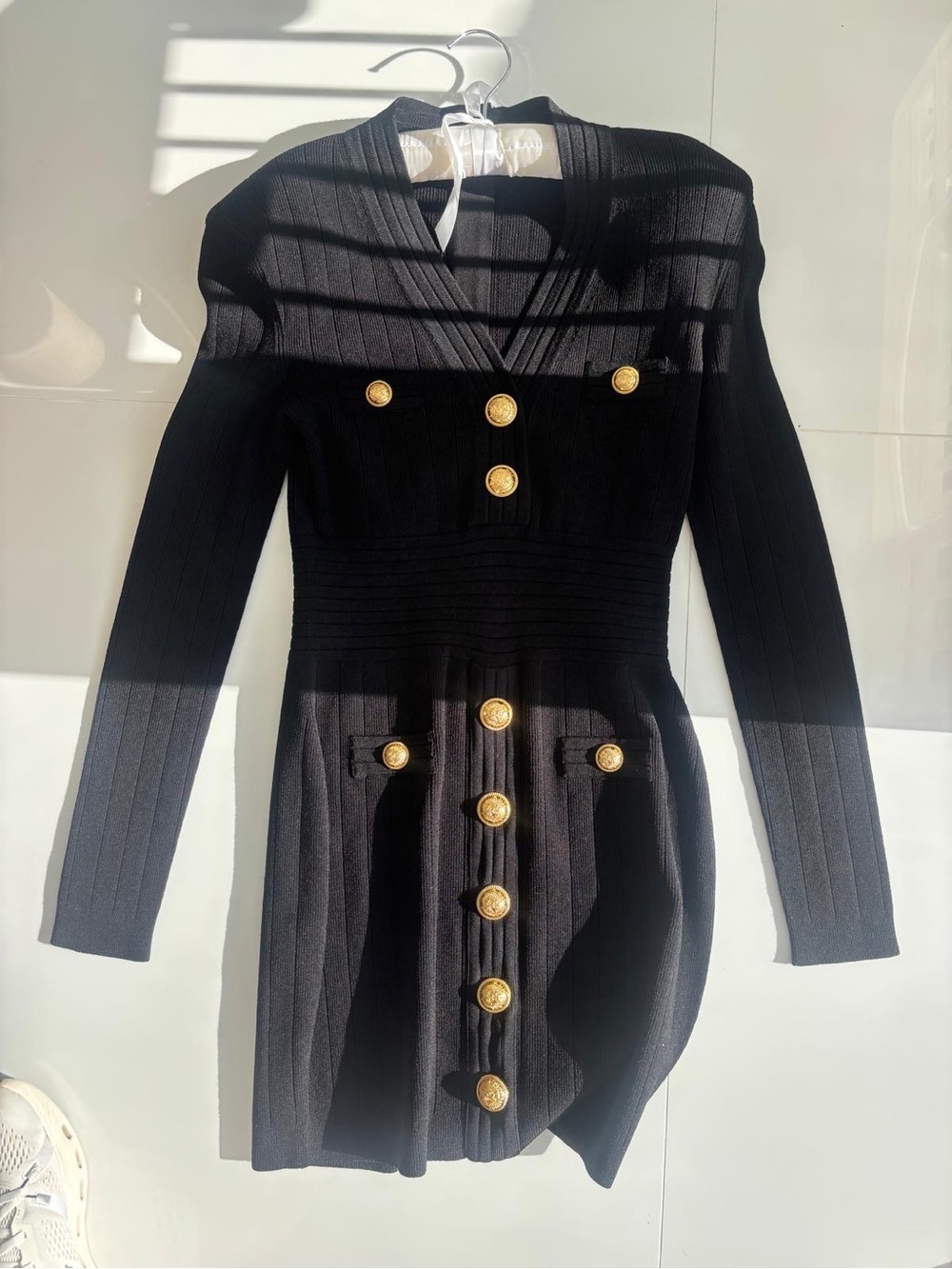 Balmain Black Ribbed Knit Mini Dress with Gold Lion Buttons
Size: 40 (FR)